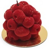 A pinkish red cake with shape of cherry in cluster